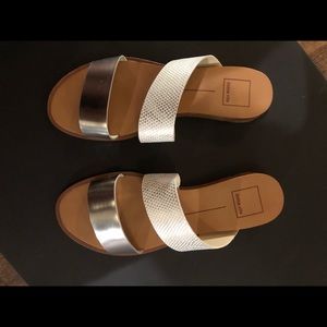 White and silver Dolce Vita sandals.
